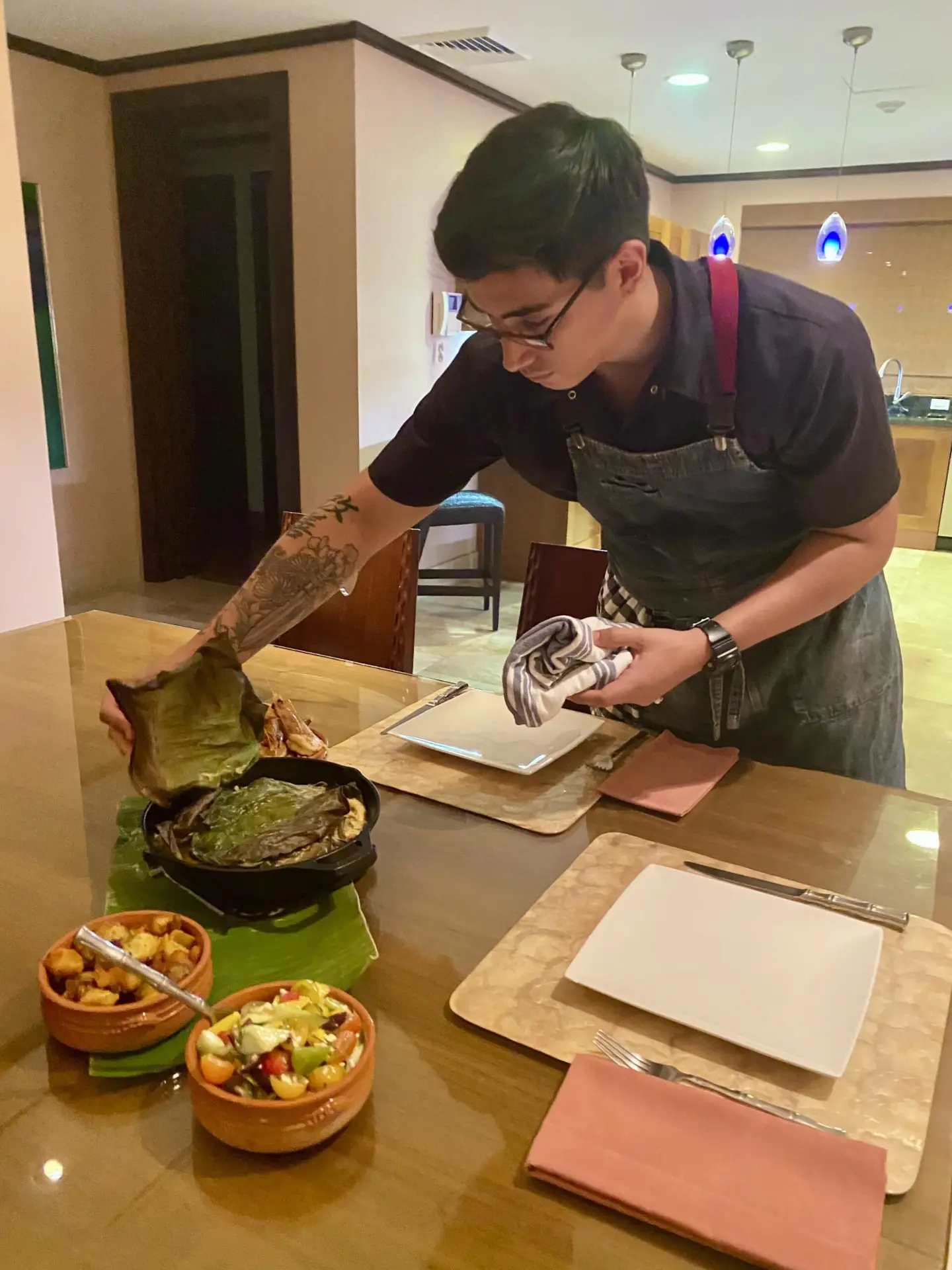 Chef serving a freshly prepared villa dinner